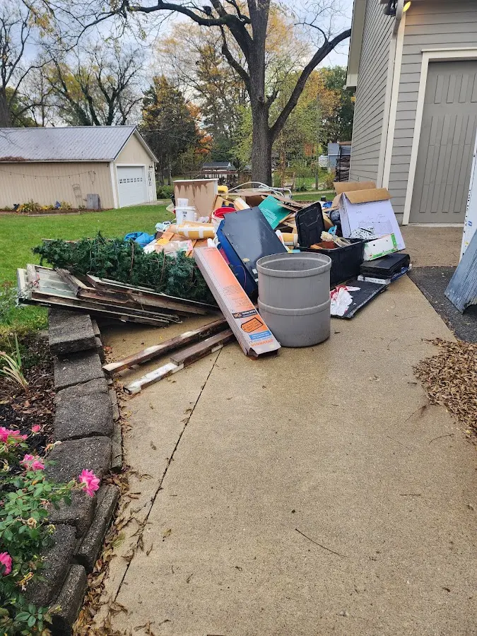 Dumpster being loaded with debris for Estate Cleanout Dumpster Rental in Somerset